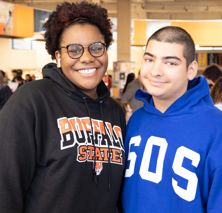 two students standing next to each other