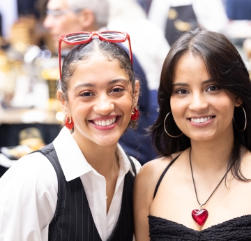 two students smiling together