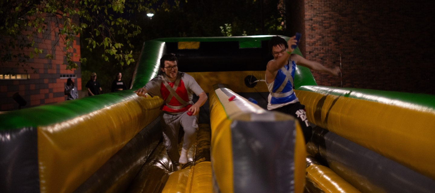 students_on_inflatable_game