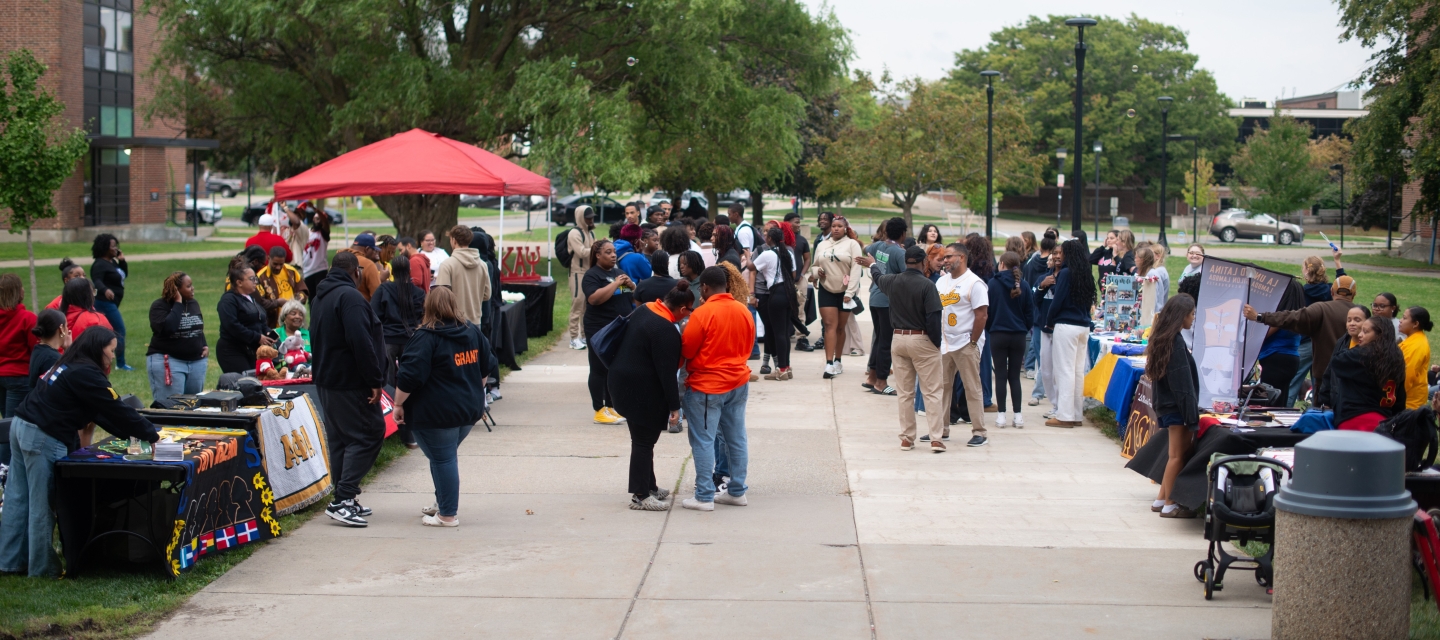 students tabling meet the greeks